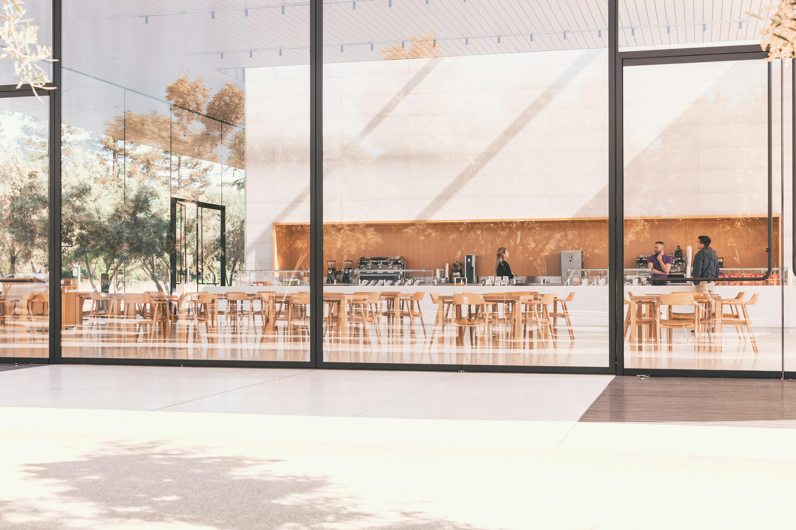 Contemporary café with glass panels and natural light in Cupertino.